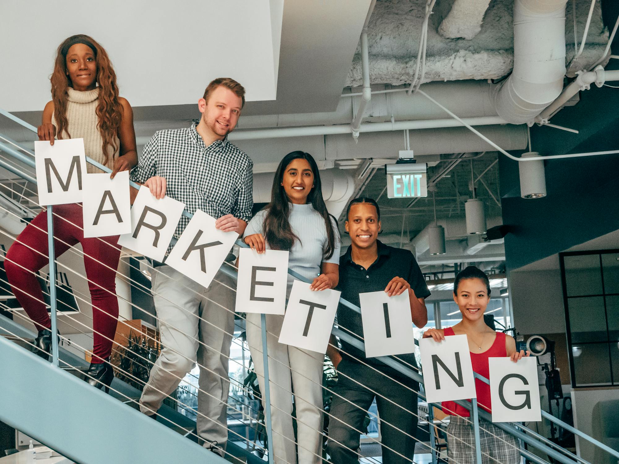 A modern business team discussing digital strategy in a bright office