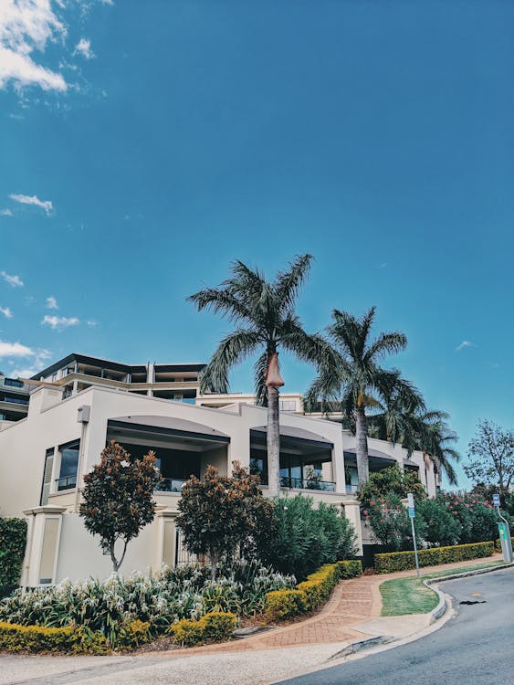 A modern business complex with diverse architectural styles under a clear blue sky
