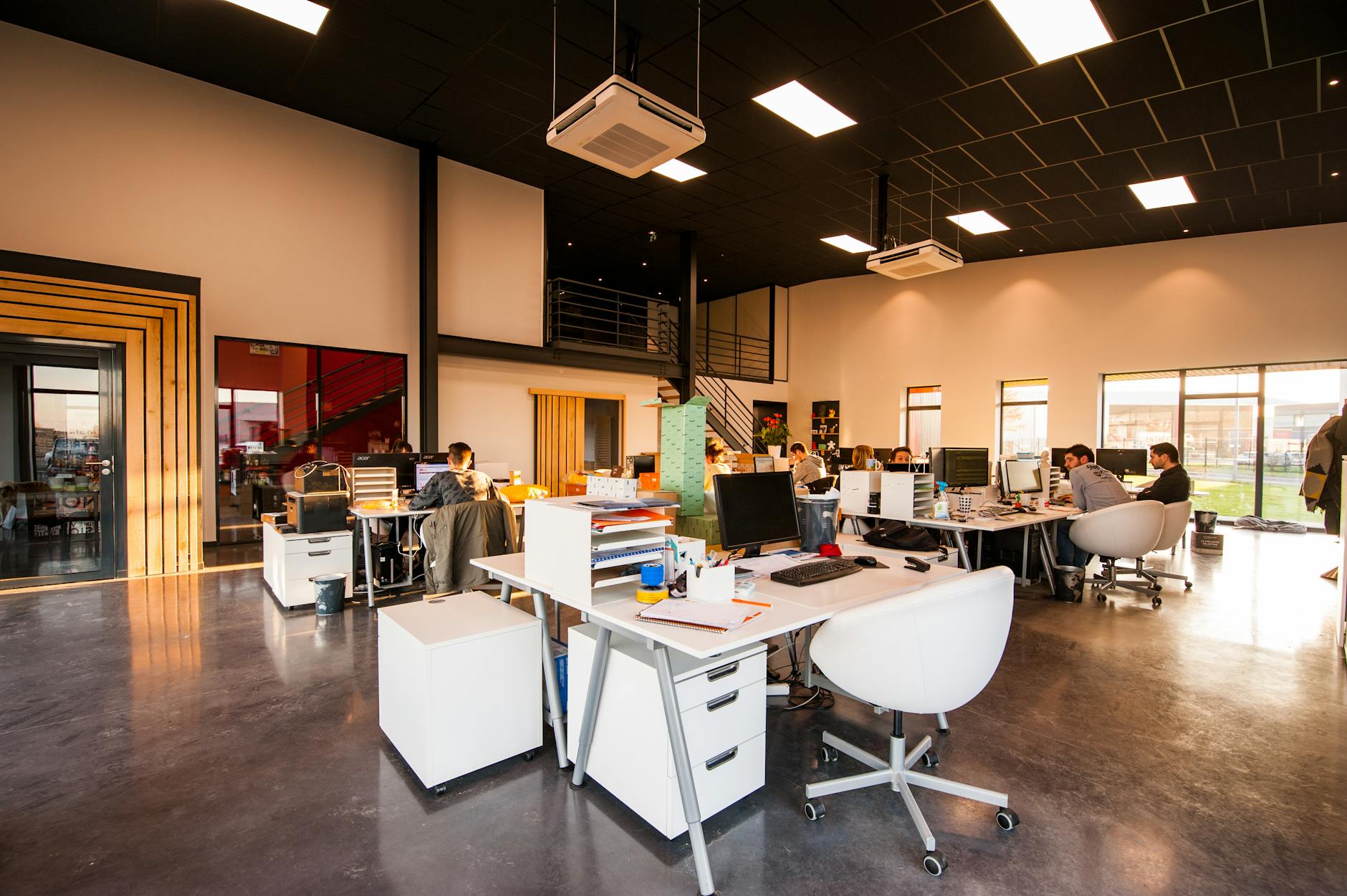 A modern business meeting in a furniture store setting