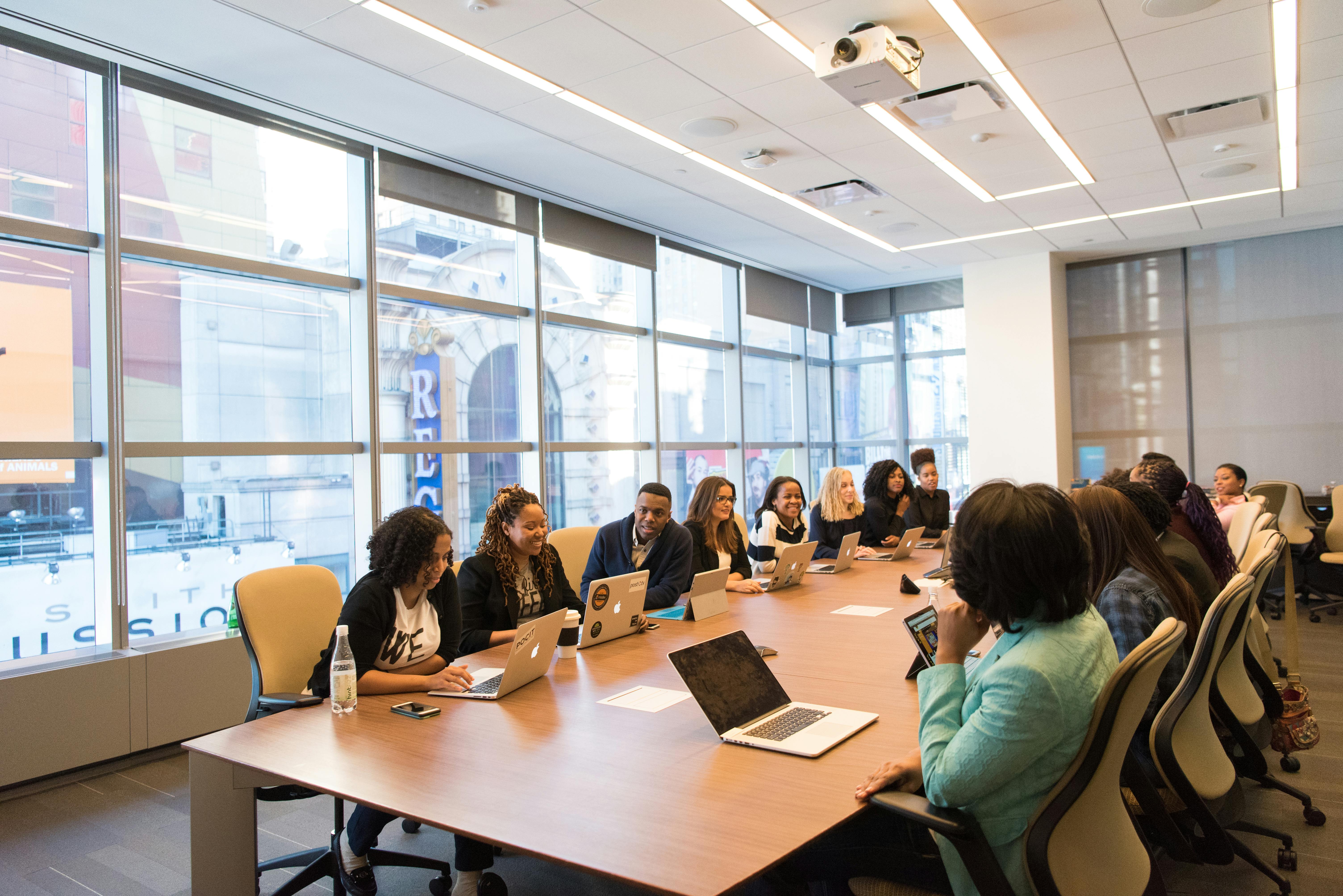 Business people discussing over documents in a modern office