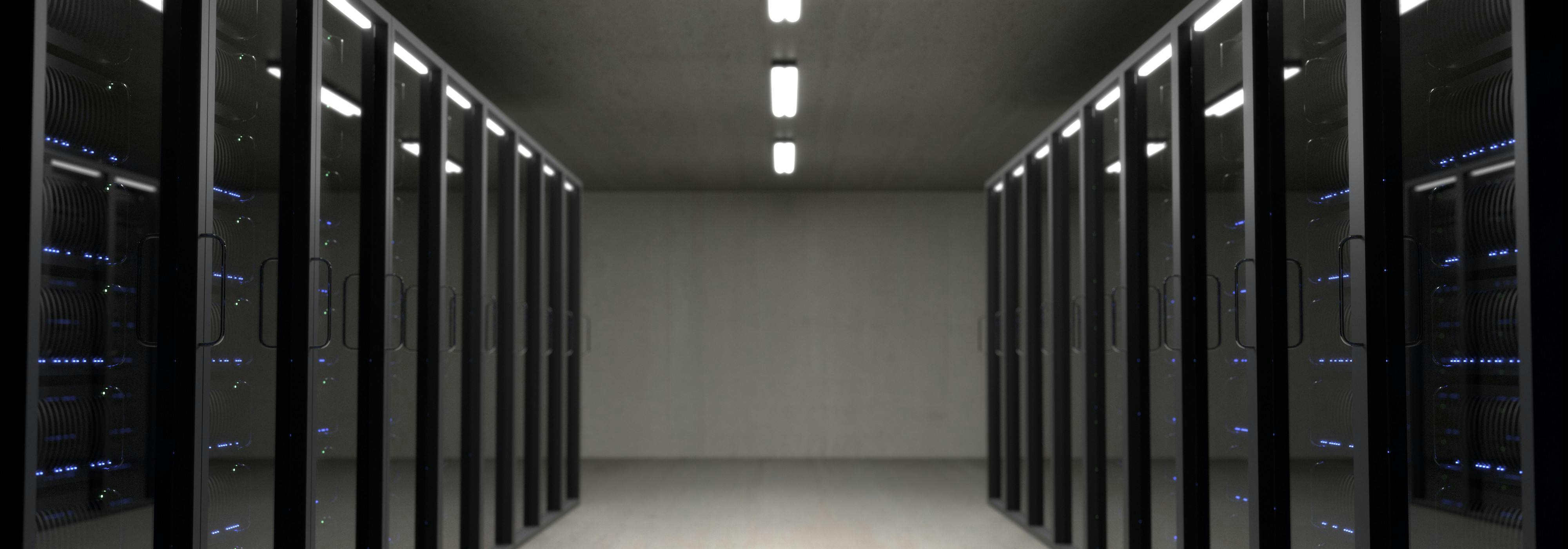 A modern server room with blue lights, symbolizing stable data operations and 24/7 technical support